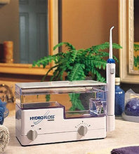 Load image into Gallery viewer, Hydro Floss Oral Irrigator - New Generation Hydro Flossing Machine - Hydromagnetics Lead to a Greater Reduction in Plaque and Tartar Buildup - Bonus Bottle of Tea Tree Oil By Toothy Grins
